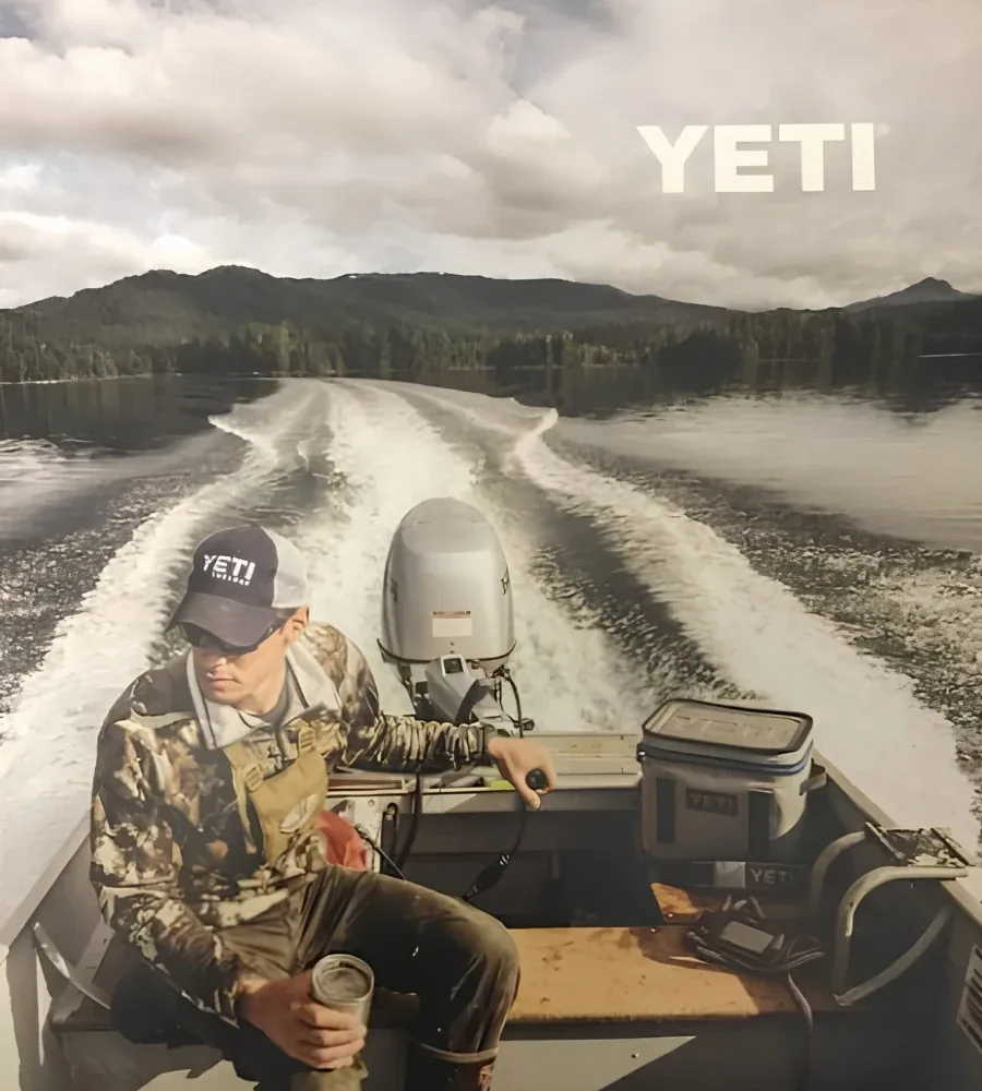 MeatEater and YETI campaign featuring an angler aboard a boat on a lake